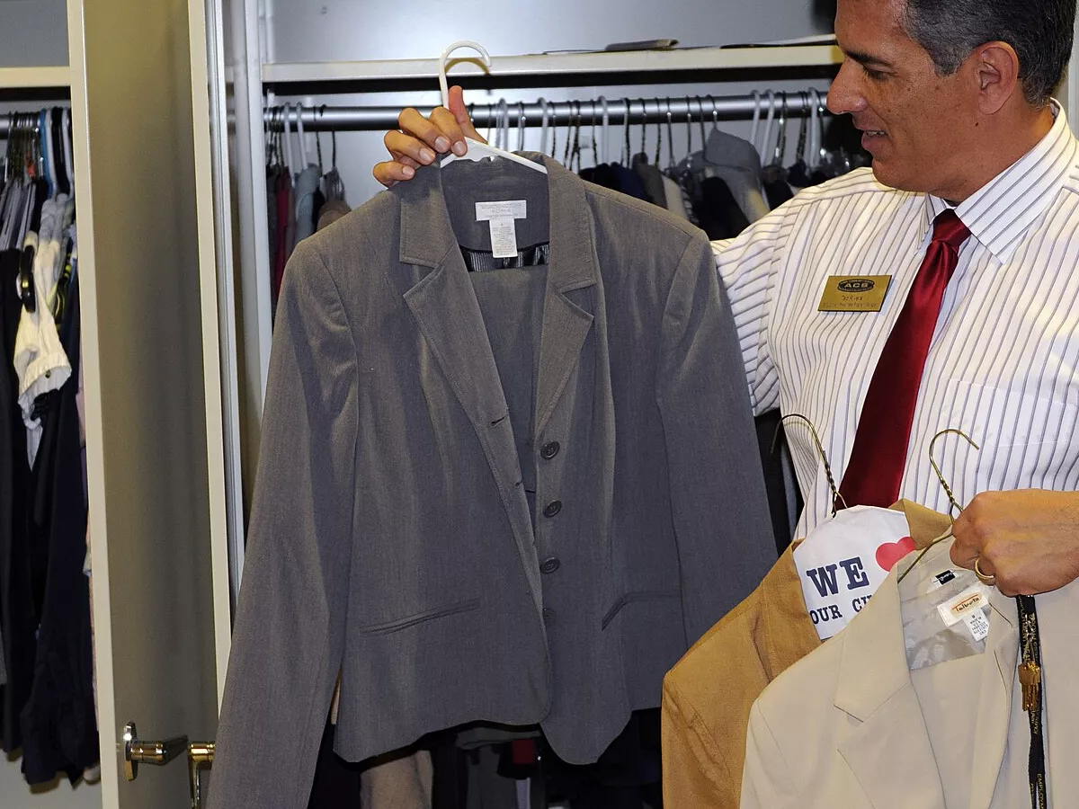 Representative image: Ted Rivera, Fort Bliss Employment Readiness program manager, shows off examples from the Attire For Hire program which helps military spouses with no professional attire for job interviews. The clothing and shoes were do