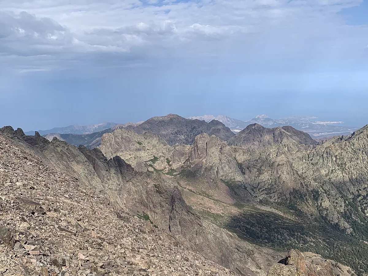 Representative image: Hiking trail GR20, Monte Cinto, a view to Calvi coast and "a Muvrella" mountain chain.