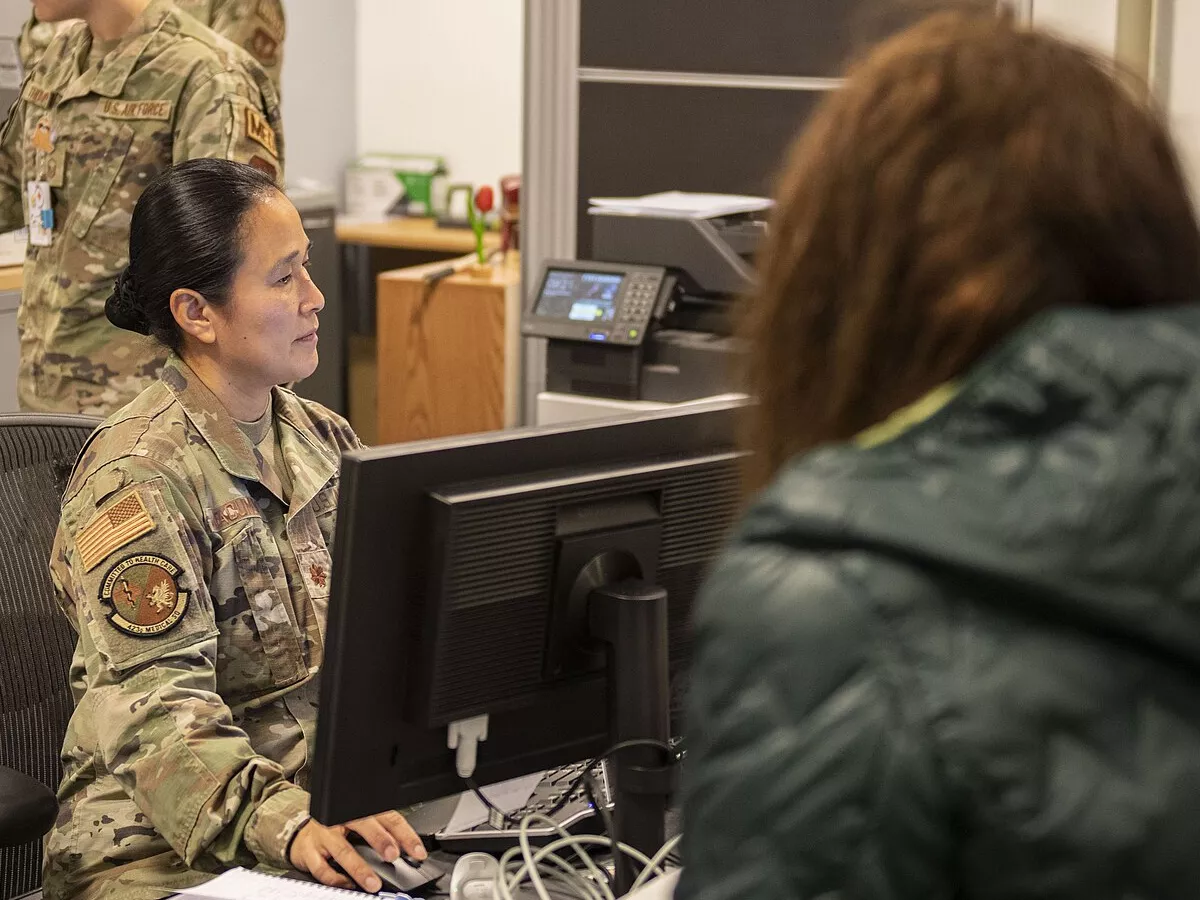 Representative image: Maj. Rowena Dacumos, 423d Medical Squadron medical operations flight commander, left, checks a patient into the clinic at RAF Alconbury, England, Nov. 8, 2023. The patient was waiting to get a flu shot as part of a mass