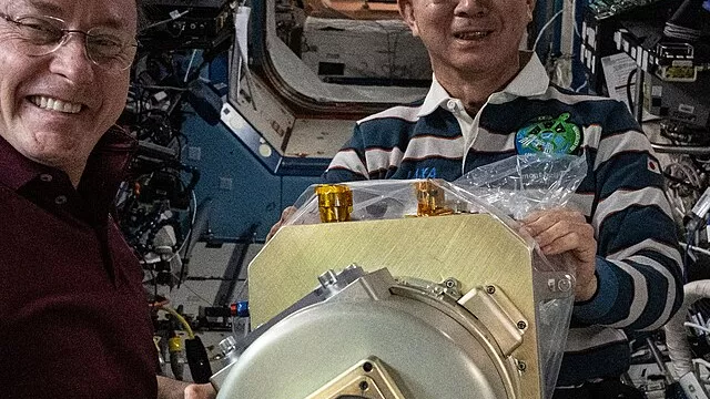 Representative image: iss073e0982900 (Oct. 28, 2025) --- Expedition 73 Flight Engineers Mike Fincke of NASA and Kimiya Yui of JAXA (Japan Aerospace Exploration Agency) work together to configure research hardware for the Zero Boil-Off Tank ph