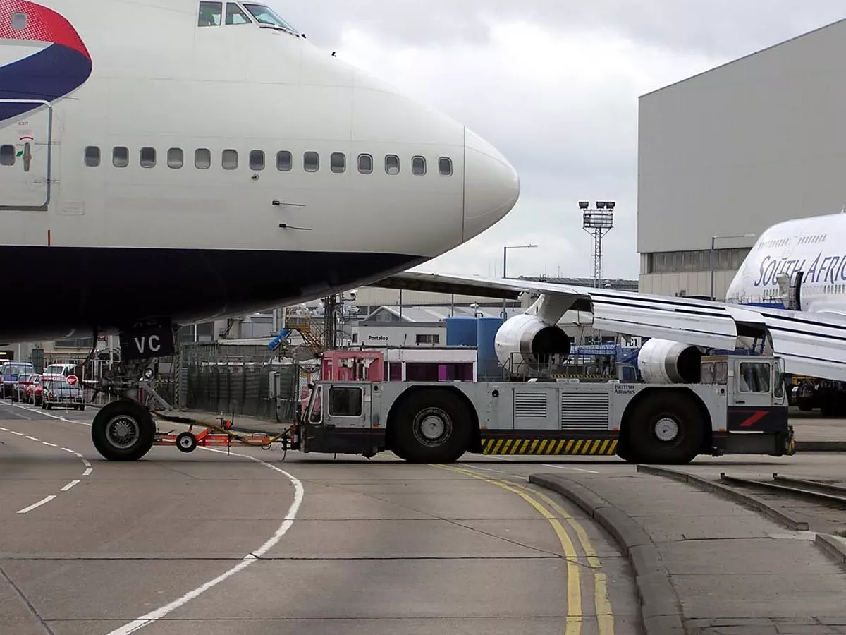 Representative image: A ground-handling tug pulls a British Airways Boeing 747-400 (G-CIVC) at London (Heathrow) Airport, England.
